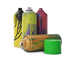 Used cans of spray paints on white background. Graffiti supplies