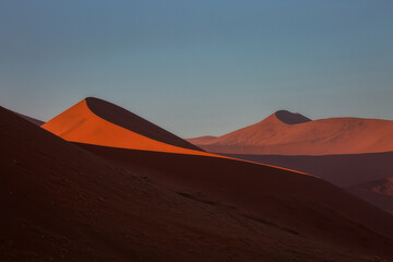 Fototapeta na wymiar Sunrise on the beautiful dunes of the Namib Desert, Sossusflei, Namibia, Africa