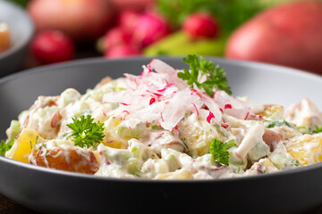 Potato salad with celery, green onion, radish, dill and eggs