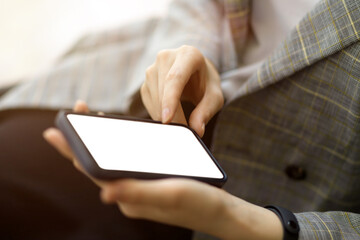 Female entrepreneur relaxing with her smartphone, interacting on social media