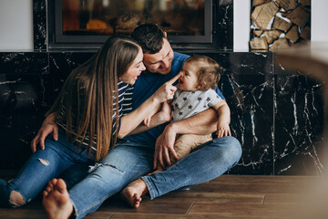 Young family with their little son at home