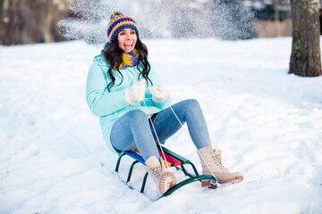 Full size photo of young pretty charming excited funky funny girl riding sledge having fun winter...