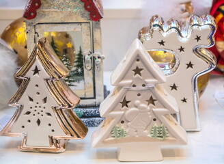 Christmas souvenirs in the form of porcelain figurines of a Christmas deer and a Christmas tree
