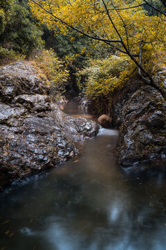 natural pool with dark rocks and summer storm rain, calm water effect,
canoves i samalus catalonia, spain