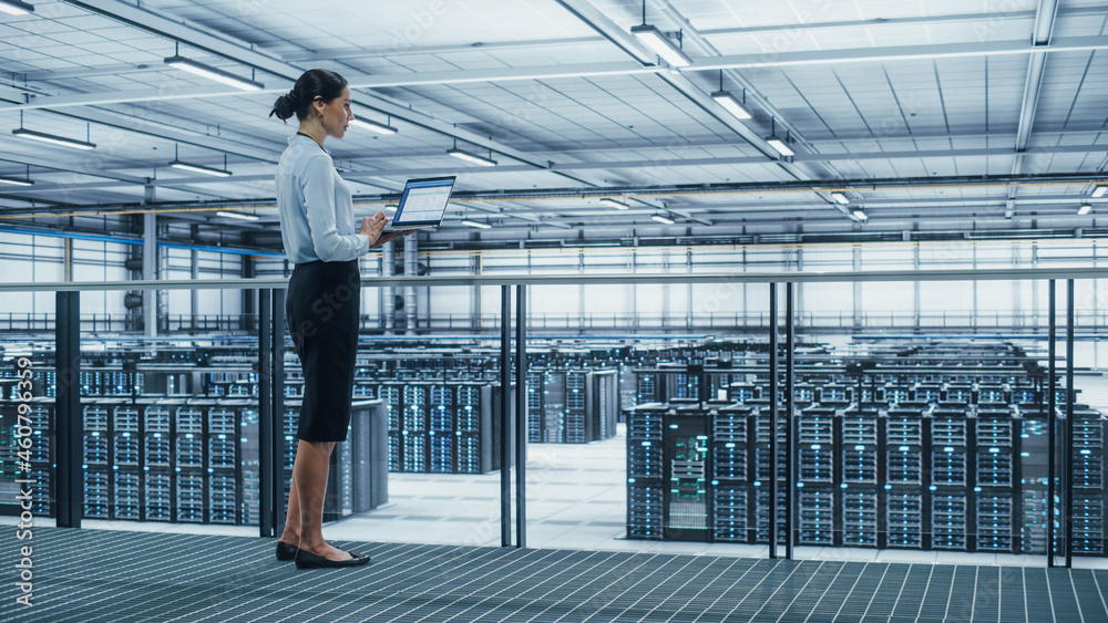Aufkleber Data Center Engineer Using Laptop Computer. Server Farm Cloud Computing Specialist Facility with Multiethnic Female System Administrator Working with Data Protection Network for Cyber Security.