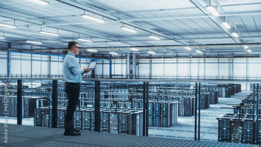 Aufkleber Data Center Engineer Using Laptop Computer. Server Farm Cloud Computing Specialist Facility with Adult Male System Administrator Working with Data Protection Network for Cyber Security.