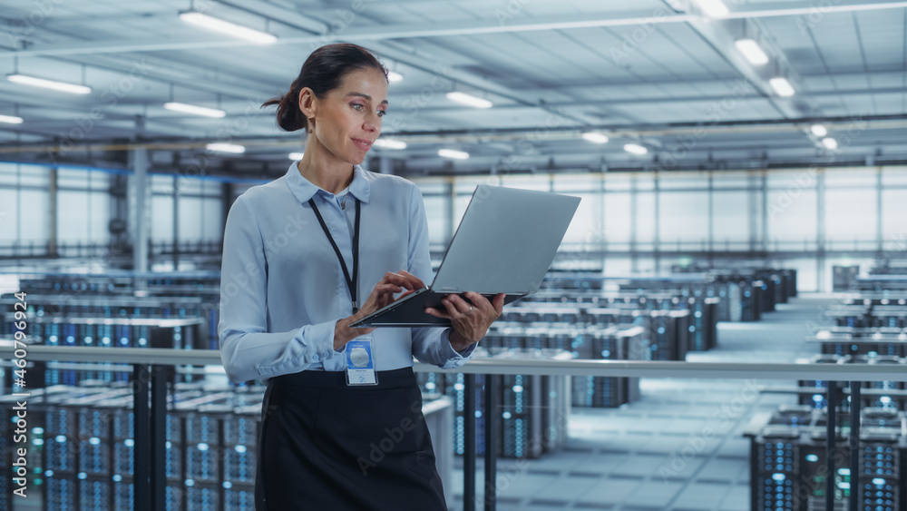 Poster Data Center Engineer Using Laptop Computer. Server Farm Cloud Computing Specialist Facility with Multiethnic Female System Administrator Working with Data Protection Network for Cyber Security.