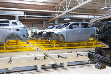 line with car bodies in a high-tech factory
