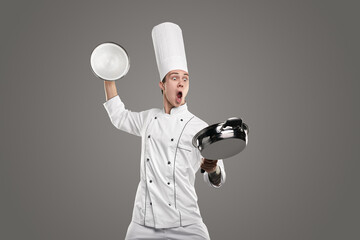 Crazy chef preparing food in frying pan