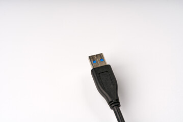 USB cable on a white background closeup.