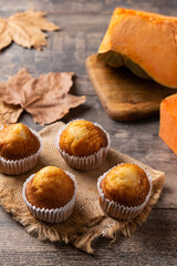 Pumpkin muffins on wooden table	