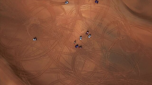Aerial lap panoramic view off road with atvs and bikes in giant Empty Quarter desert with sand dunes. The Rub' al Khali, Abu Dhabi, UAE. 4K, footage.