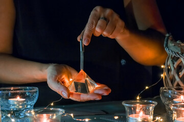 Tarot cards, Fortune telling on tarot cards at night by candlelight, magic crystal, occultism,...