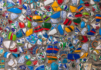 mosaic colored porcelain pieces in concrete wall