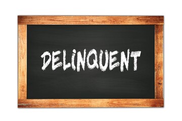 DELINQUENT text written on wooden frame school blackboard.