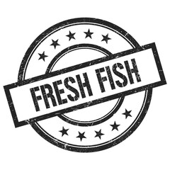 FRESH FISH text written on black vintage round stamp.