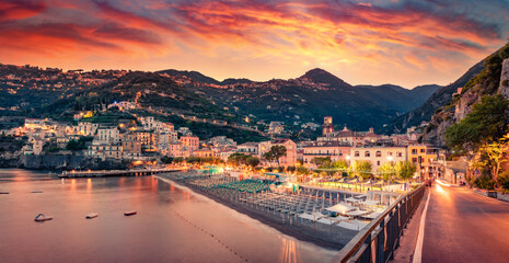 Fantastic sunset on the Mediterranean cost. Spectacular summer cityscape of Minori town. Colorful evening scene of Italy, Salerno region, Europe. Vacation concept background..