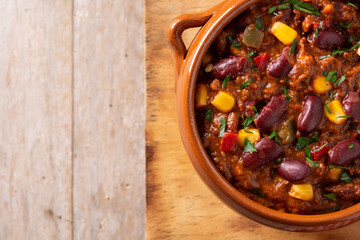 Traditional mexican tex mex chili con carne on wooden table