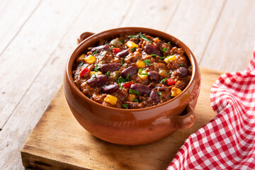 Traditional mexican tex mex chili con carne on wooden table