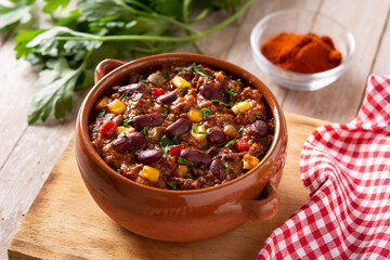 Traditional mexican tex mex chili con carne on wooden table