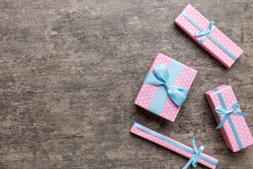 A lot of Christmas gift boxes in colored paper decorated on table, Top view close up. Many present New Year gift