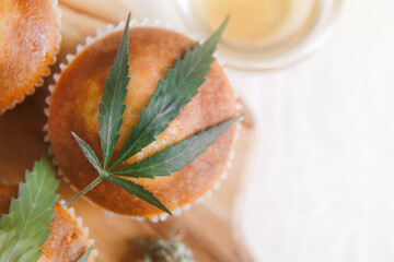 Delicious homemade muffin with CBD cannabis and leaf garnish. Medicinal Edibles. Treatment of...