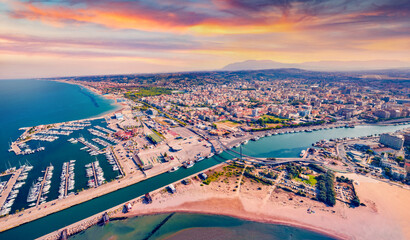 Spectacular summer view from flying drone Pescara port. Attractive sunset on Adriatic sea....