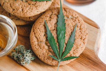 Delicious homemade cookies with CBD cannabis and leaf garnish. Medicinal Edibles. Treatment of...