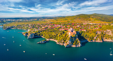 Wonderful aerial view of Duino Castle. Picturesque morning scene of Adriatic coast of Italy, Europe. Beautiful summer scenery. Traveling concept background..