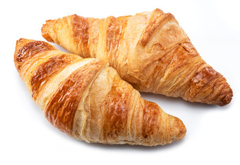Tasty crusty croissants close-up on a white background.