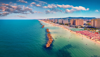 Aerial view from flying drone Montesilvano public beach. Splendid norning seascape of Adriatic sea. Breathtaking outdoor scene of Italy, Euroep. Traveling concept background..