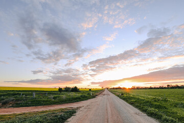 Sun setting on country road in Central Victoria, Australia. Late afternoon in Australia.