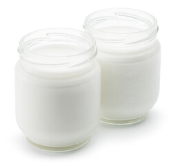 Obraz na płótnie Canvas Two glass containers with plain yoghurt isolated on white background.
