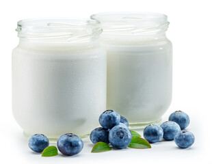 Two glass containers with plain yoghurt and berries isolated on white background.