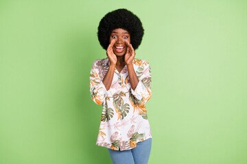 Photo of young afro girl happy positive smile speak yell announcement news advert isolated over green color background