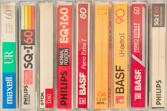 Retro styled image of a row of different vintage audio compact cassettes in Dieren, The Netherlands on October 4, 2021
