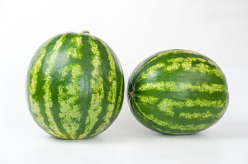 ripe watermelons on a white background and on melons