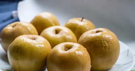 baked apples on the background of the kitchen - a healthy and delicious dessert - shallow depth of field