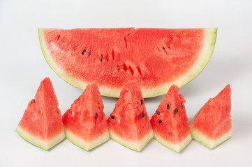 ripe watermelons on a white background and on melons