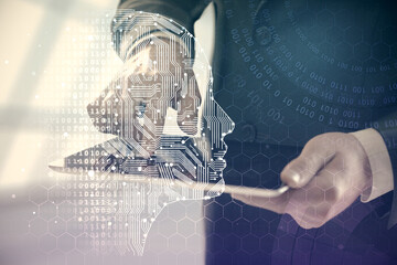 Double exposure of man's hand holding and using a digital device and brain hologram drawing. Data concept.