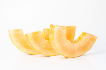 melons ripe on a white background and in the beds