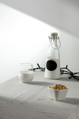 Milk on the table on a beautiful Christmas day, blank and shadow on the wall 
