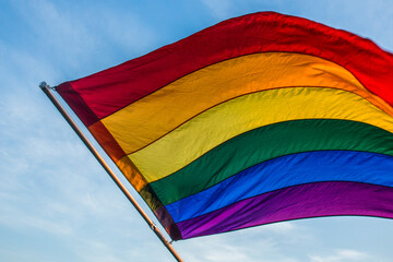 rainbow flag on blue sky