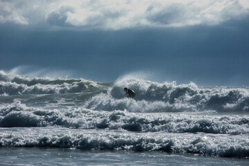 Surfer in stormy weather