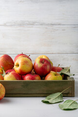 Close up of apple on table and crate autumn concept copy space