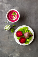 Creamy red beetroot soup with raw beets and sour cream