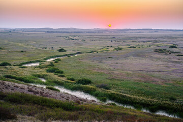 Fototapeta na wymiar Morning summer landscape with sunrise over the valley of the steppe river. Bolshaya Karaganka river near Arkaim village, Russia