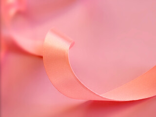 Pink satin ribbon on pink background. greeting card. saint valentine day. mother's day