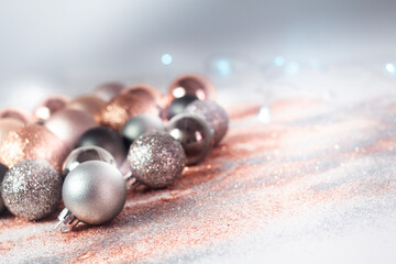 Silver, green, and gold Christmas baubles