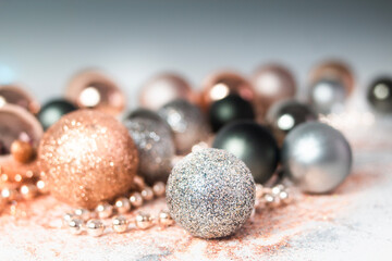 Silver, green, and gold Christmas baubles